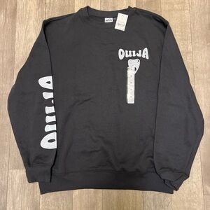 Black Crewneck Sweater with Ribbed Cuffs and Graphic Design